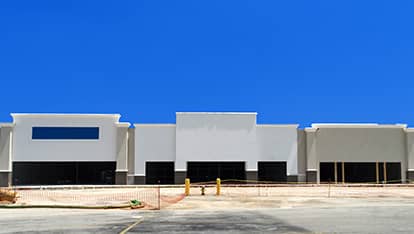 Denver commercial roof installation companies installation a roof on a big retail center