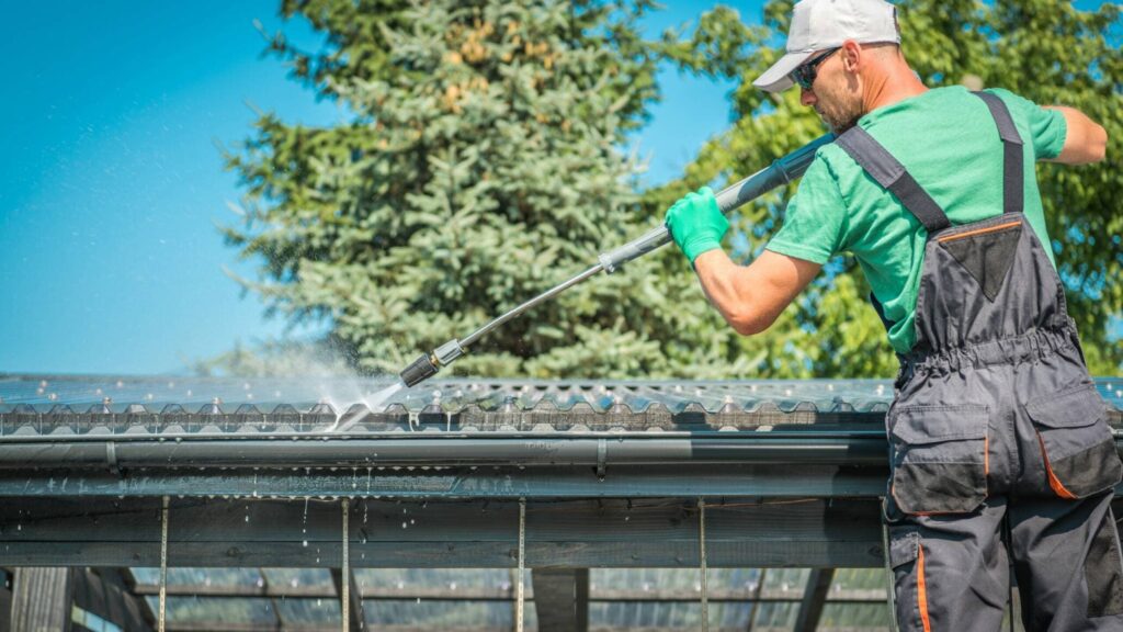 A roof getting powerwashed