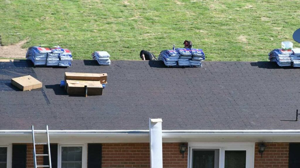 Roofing materials on the top of a residential roof ready to install