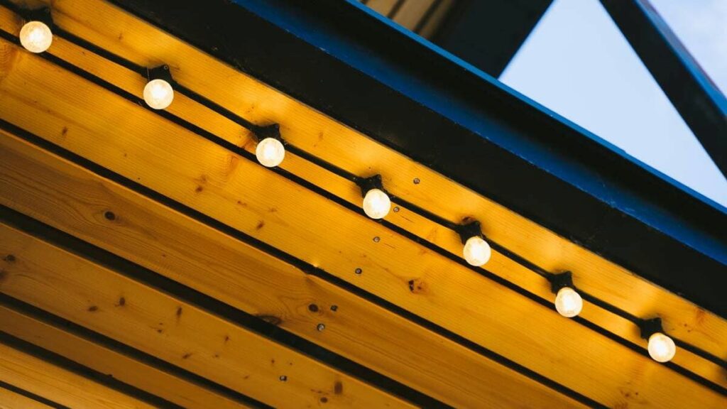 Holiday lights on the eve of a roof