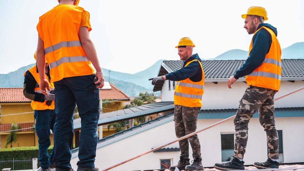 Roofing team discussing the project