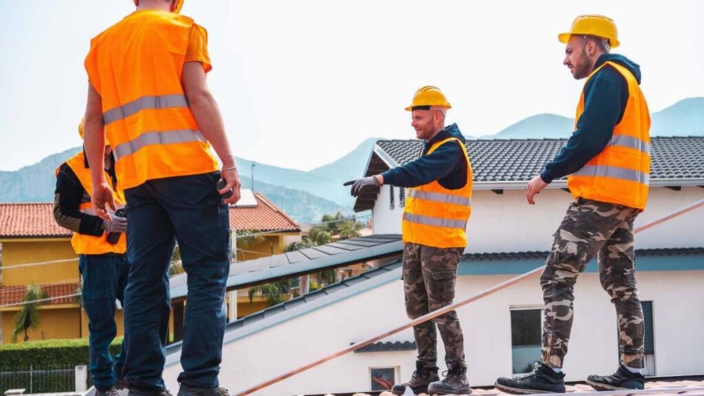 Roofing team discussing the project