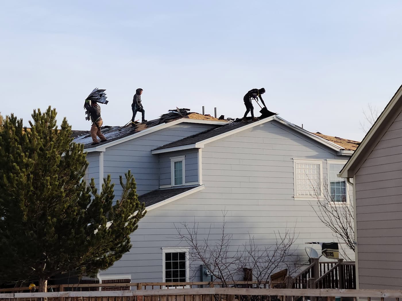 3O3 roofer team replacing a roof on a condo