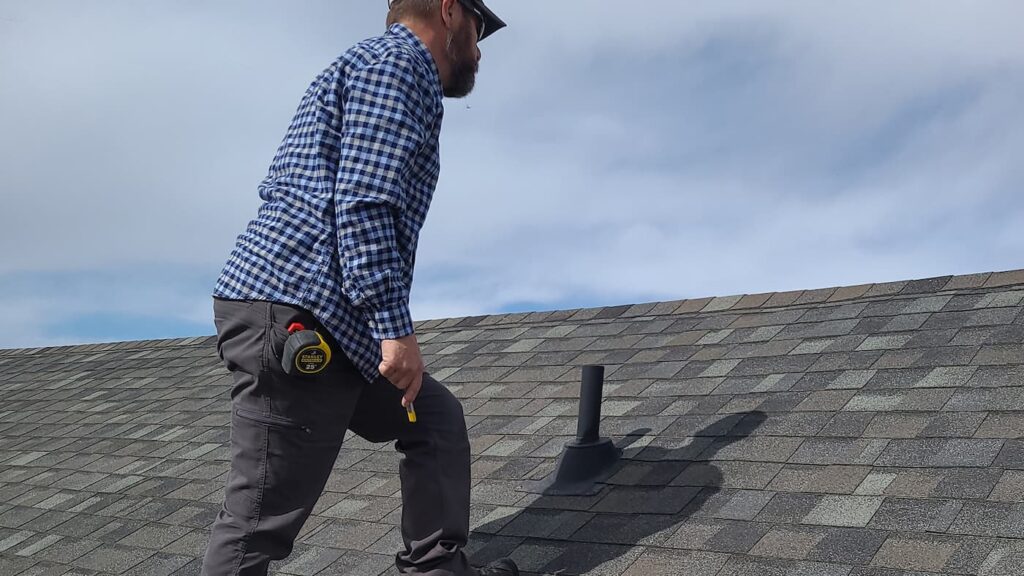Ken inspecting a roof