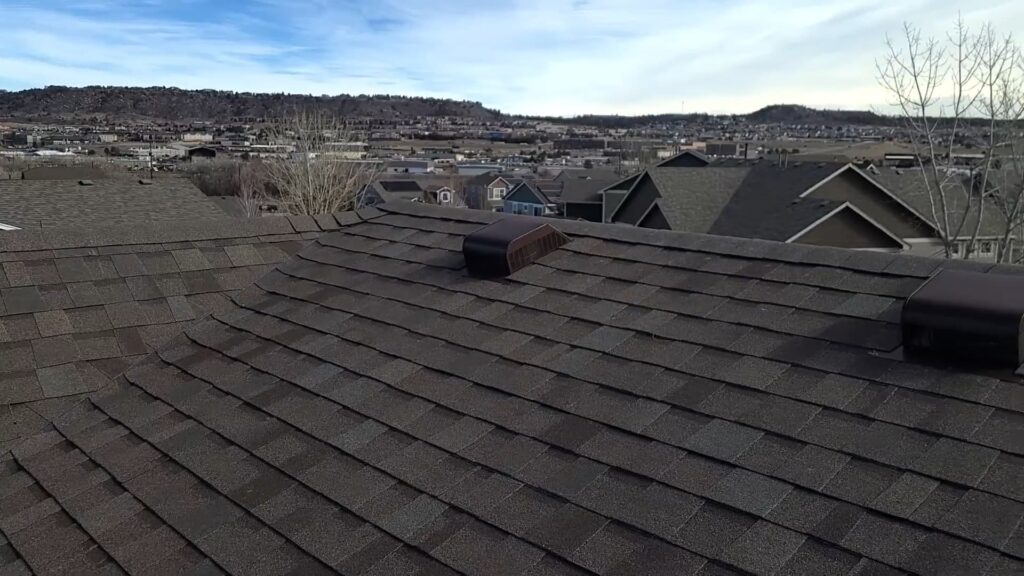 multiple rooftops with different colored shingles