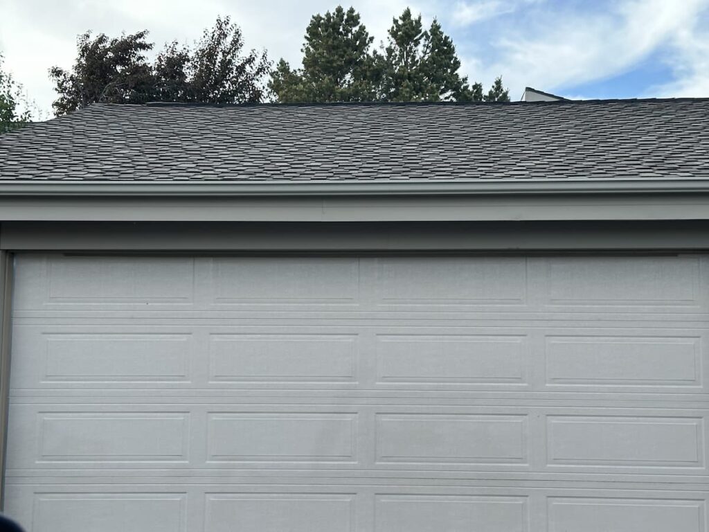 a garage roof with a new layer of shingles