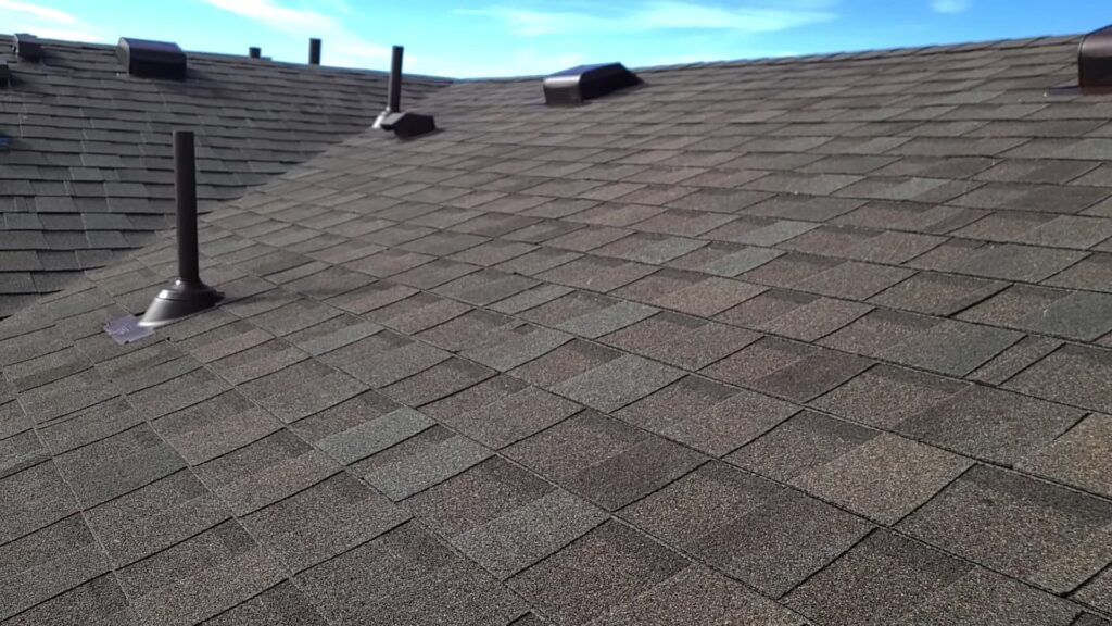 a roof of a house with asphalt shingles