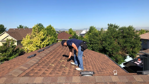 inspecting a residential roof after a storm