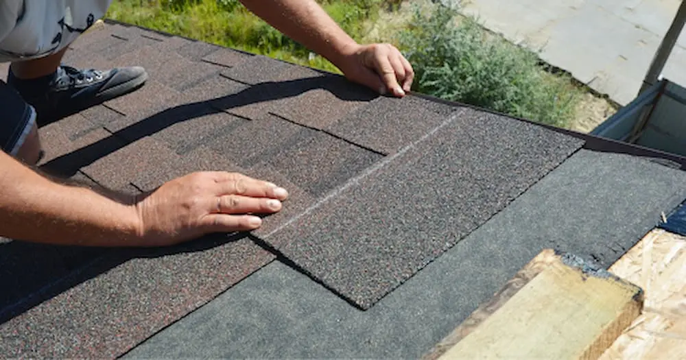 asphalt shingles being installed on a denver roof